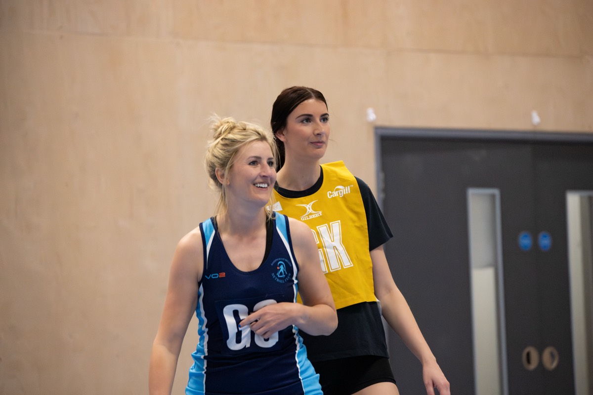 Two opponents share a laugh between plays